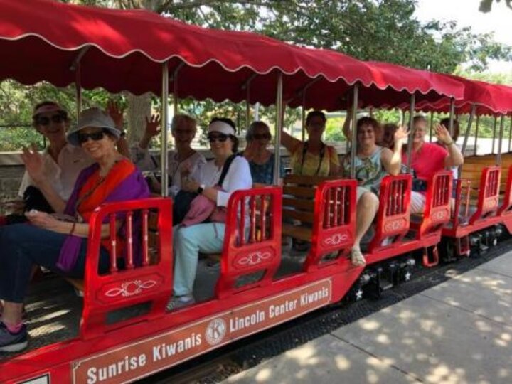 Club members at the Lincoln Children's Zoo ride the train.