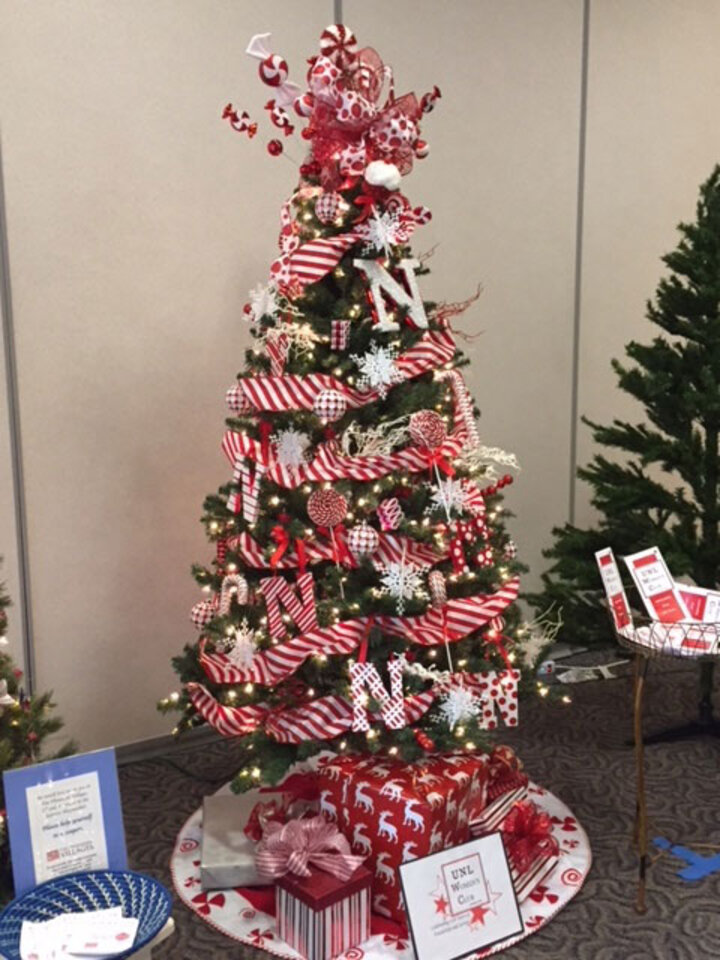 A full Christmas tree decorated in Husker themed ornaments.