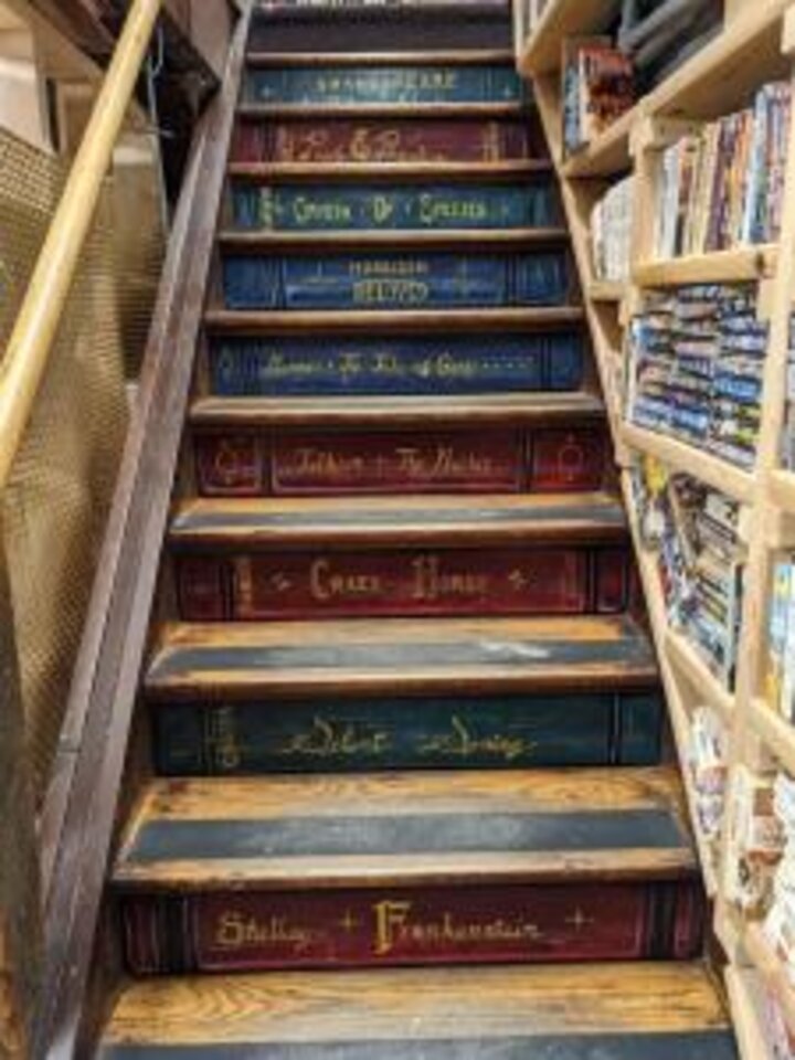 The stairs that lead downstairs at A Novel Idea Bookstore.