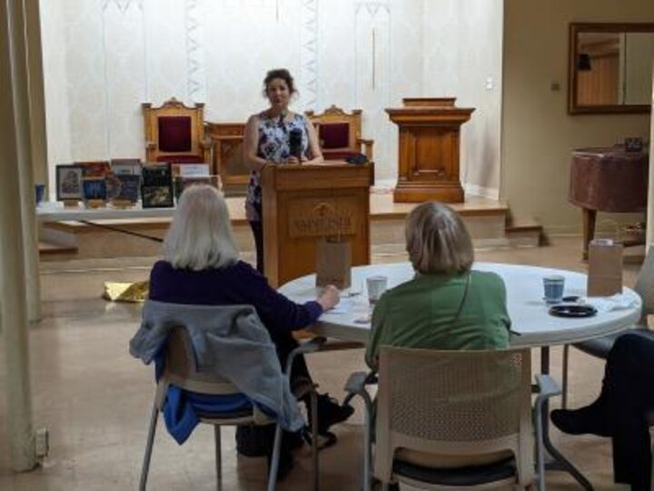 Members listen to presentation.