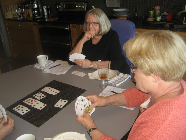 A few women play cards.