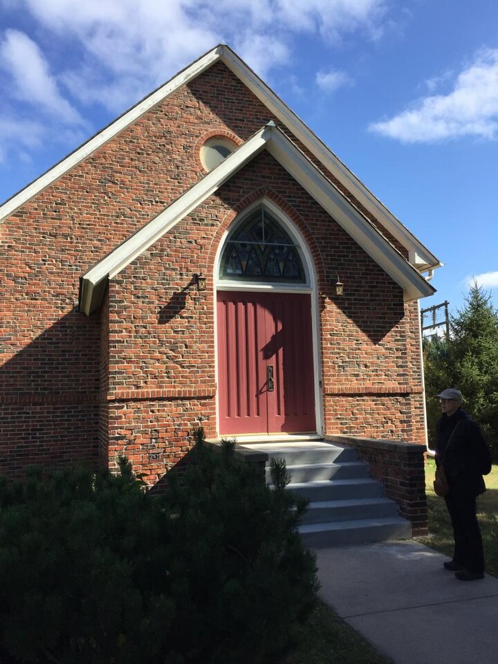 Simple brick entrance to a church.