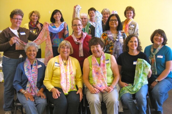 Club members pose with completed scarves.