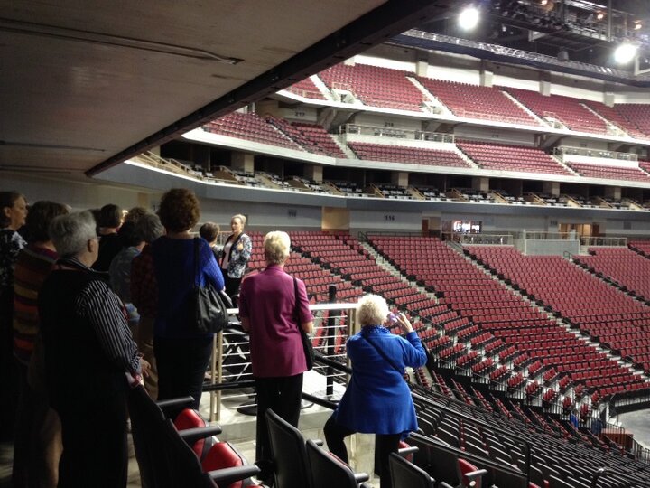 Club members stand along aisle of seat at Pinnacle Bank Arena