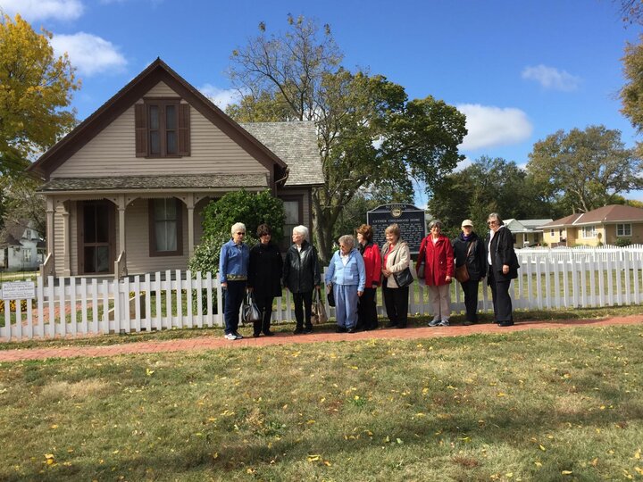 Womens group pose outside of Willa Cather's house in Red Cloud, NE.